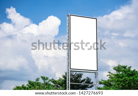 white billboard blank canvas mockup for outdoor advertising poster or blank billboard at day time and cloud and blue sky background .