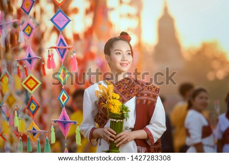 Beautiful woman in traditional dress costume,Asian woman wearing typical Thai dress identity culture of Thailand