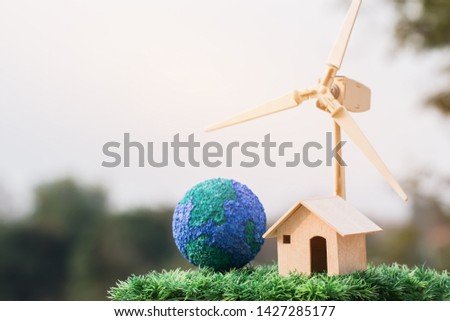 Future Alternative energy / Green Clean electric energy from renewable sources wind turbines for home and save earth. Idea on sustainable eco residential family house,use ecology renewable