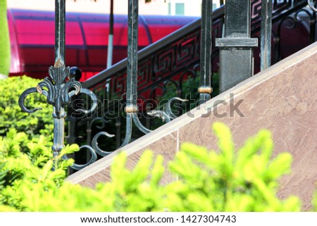 construction details and ornaments made of iron forged fence, gates and arches