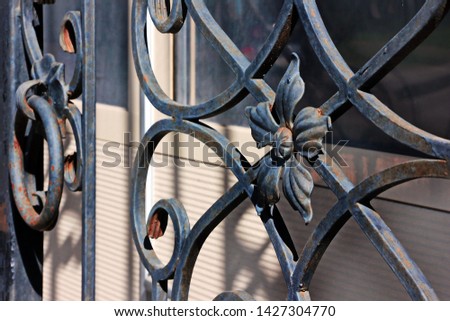 construction details and ornaments made of iron forged fence, gates and arches Royalty-Free Stock Photo #1427304770