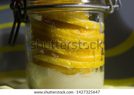 Lemon in a jar of sugar for tea photo for text