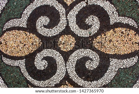 Gorgeous traditional Balinese pebble stone stonework on pavement - usually in gardens - in Bali, Indonesia
