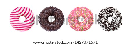 Donuts Set Isolated on White. Different type of donuts: with chocolate, pink with stripes, with glaze and colored splashes and sprinkled black cookie Royalty-Free Stock Photo #1427371571