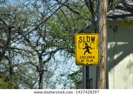 Slow - children at play, street sign