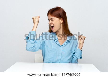 cheerful emotional woman desktop blue shirt