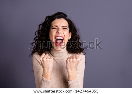 Close up photo attractive amazing she her lady fists hands arms raised yelling loud gladness news novelty buy buyer shopping black friday prices wear casual pastel pullover isolated grey background