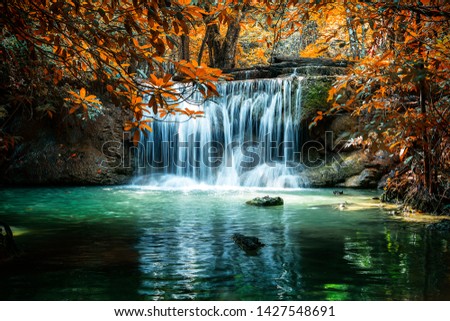 Amazing beautiful landscape unseen Thailand, Huay Mae Khamin Waterfalls at Srinakarin National Park, Kanchanaburi, Thailand. Idyllic waterfall in autumn forest at sunlight.