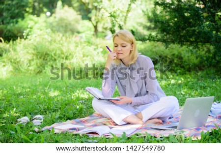 Guide starting freelance career. Become successful freelancer. Woman with laptop sit on rug grass meadow. Girl with notepad write note. Business lady freelance work outdoors. Freelance career concept.