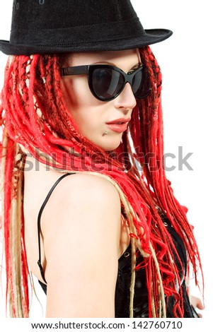 Portrait of expressive girl with great red dreadlocks. Isolated over white.