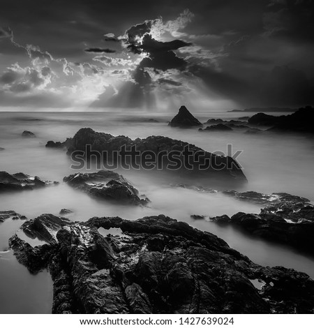 Black & White rocky seascape scene.Beautiful long exposure seascape, rocky beach in black and white. Nature composition