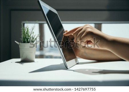Close up of woman hand's using tablet touch screen
