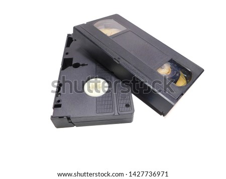 Two old vhs tapes stacked on white background 