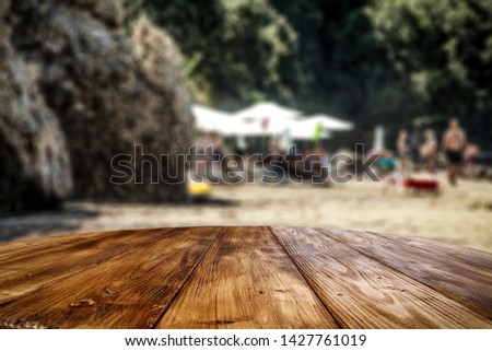 Table background of free space for your decoration and summer landscape of beach with sea. Summer time. 