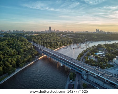 Luzhniki stadium, Moscow river and metro bridge on Sparrow Hills (Vorobyovy Gory) at sunset in Moscow, Russia on may. Aerial drone view Royalty-Free Stock Photo #1427774525