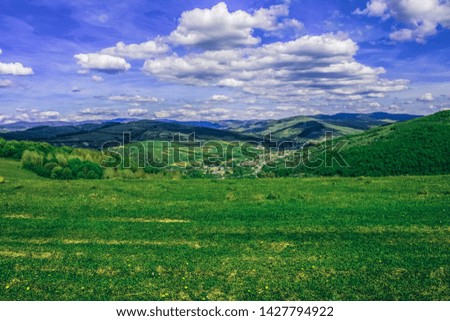 bright colorful green summer mountain highland nature scenery landscape photography with valley foreground and forest hill land background