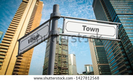 Street Sign the Direction Way to Town versus Village