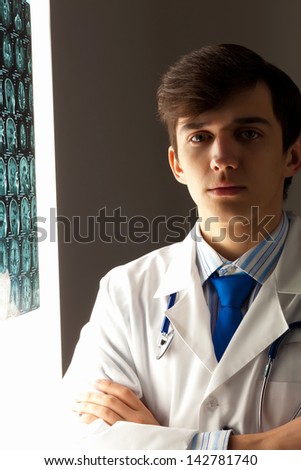 Image of male radiollogist with x-ray results