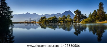 France, Hautes-Alpes (05), Ecrins National Park. Saint-Apollinaire Lake and Grand Morgon (Pic de Morgon) in early morning summer light. European Alps