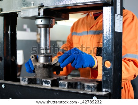 Work on the hydraulic press. Car repair Royalty-Free Stock Photo #142785232