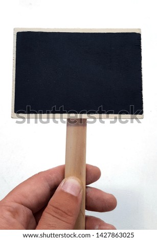 Hand holding a chalkboard sign on white background