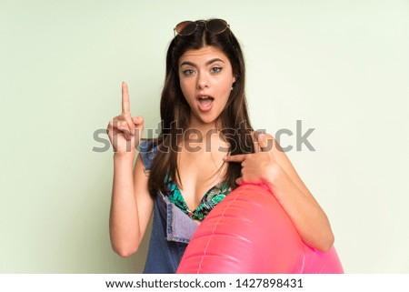 Teenager girl on summer vacation with surprise facial expression