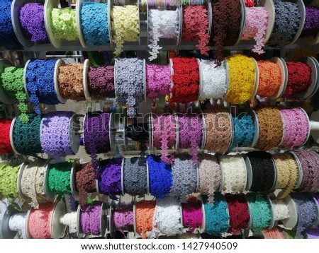 Colorful Lace fabric in roll display at store
