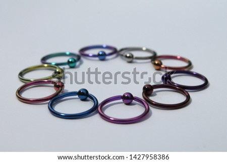 Anodized titanium 1.6mm x 14mm captive ball ring (CBR) body jewellery Royalty-Free Stock Photo #1427958386