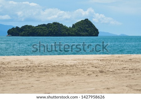 Untouched sandy beach at summer day in Langkawi Island, Malaysia.