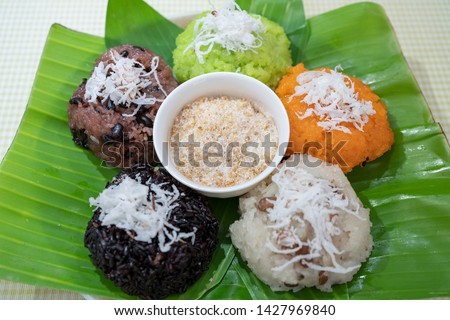Colorful of sticky rice and sesame salt on banana leaf. Famous street food or fast food for breakfast in Vietnam. Traditional food. Royalty high quality free stock image. Beautiful sticky rice.
