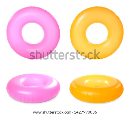 Set of bright inflatable rings on white background Royalty-Free Stock Photo #1427990036