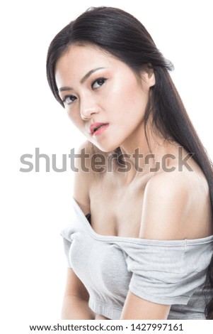 Asian woman model beauty shot in studio on white background.