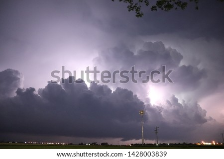 Lightning illuminates a severe thunderstorm as it moves towards a small town in western Nebraska. 