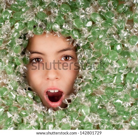 little girl buried on green candies