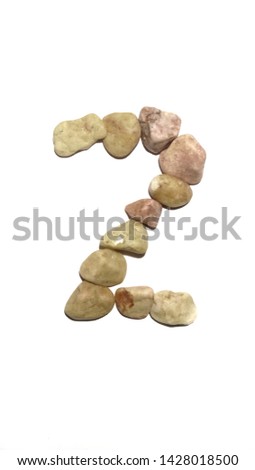 Arrange the stone into numbers  two isolated