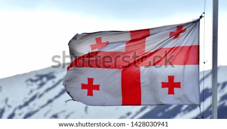 Georgian flag flying in the Caucasus mountains