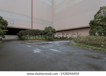 Asphalt concrete flooring and factory buildings