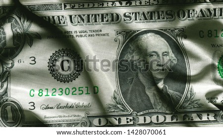 Close up of one dollar on waving fabric background, wallpapers, close-up