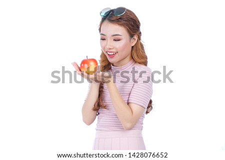 Asian young healthy beautiful attractive pretty girl with red apple on white background