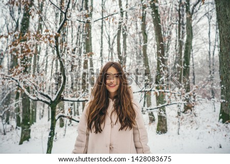 Beauty Winter Girl in frosty winter Park. Winter woman fan. Winter woman snow. Outdoors