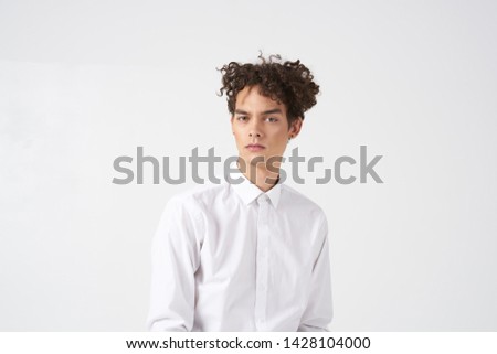 Guy curly hair white shirt beautiful face cropped look                              