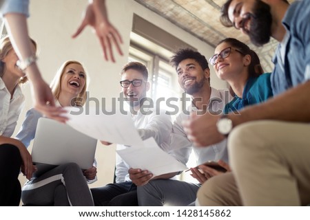 Successful happy group of people learning software engineering and business during presentation Royalty-Free Stock Photo #1428145862