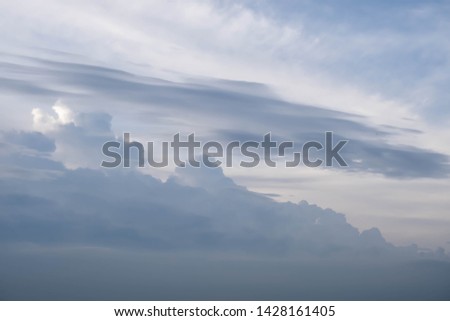 Blue sky background with tiny clouds 