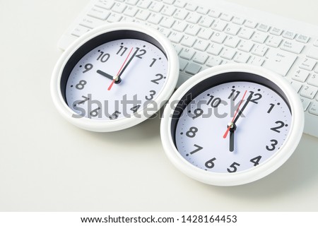Business concepts, clock indicating working time Royalty-Free Stock Photo #1428164453