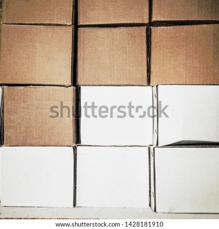 Background with cardboard boxes. White and brown boxes