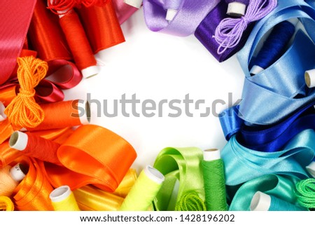 Colored threads. Rainbow. Colored yarn balls and silk ribbon. Handmade 