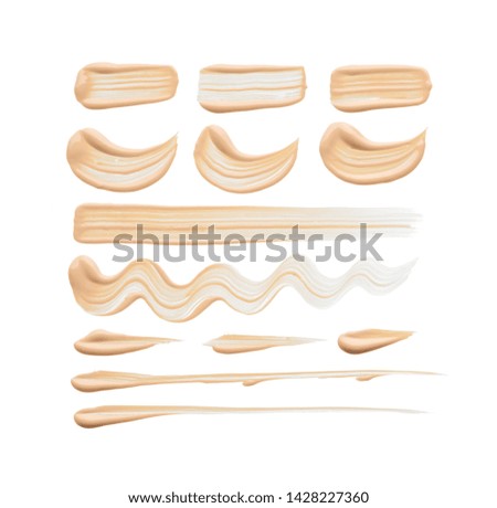 Gently beige strokes and texture of concealer isolated on white background