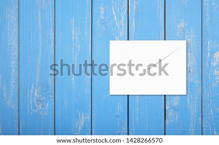 Postage and packing service - Top view Envelope on a blue wood plank background.