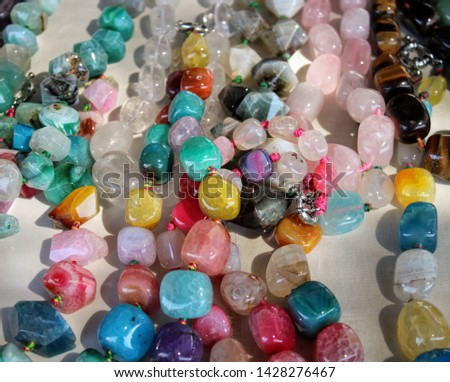 Necklaces of gems of different shapes and colors hand made