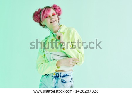 woman with pink hair smiling makeup hairstyle